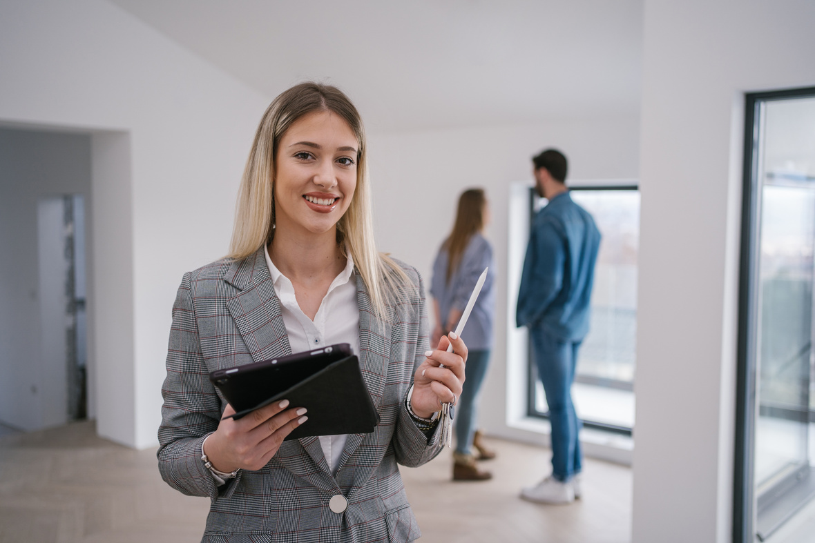 Beautiful young real estate agent